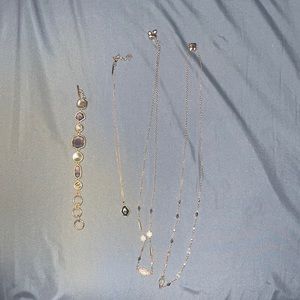 Kendra Scott three necklace is in one bracelet bundle